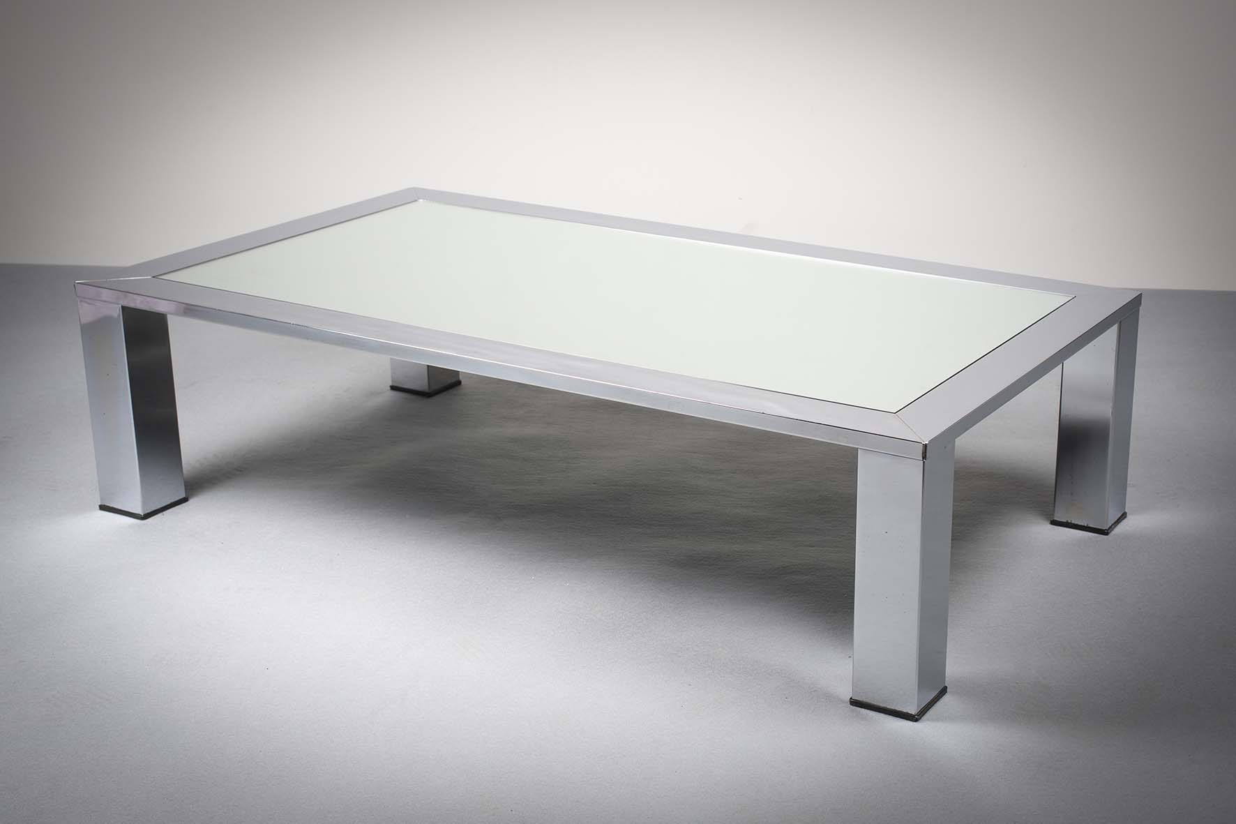 A POLISHED CHROME RECTANGULAR COFFEE TABLE, FRENCH 1970s, with inset mirrored top, on block feet,