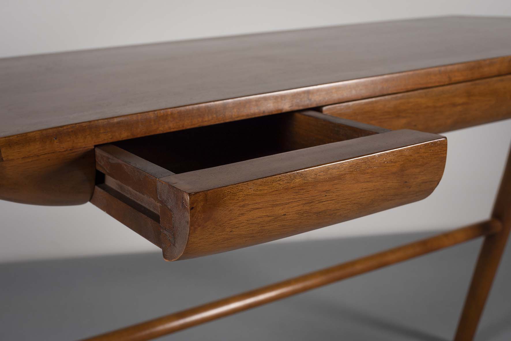 A FINE TEAK DESK, DANISH, with three cushioned frieze drawers, on tapering forked legs, joined by - Image 2 of 2