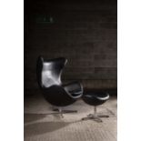 THE EGG CHAIR AND OTTOMAN, BY ARNE JACOBSEN FOR FRITZ HANSEN, EDITION 2008, in hand stitched black