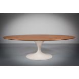 AN ELLIPTICAL LOW TULIP TABLE, BY EERO SAARINEN FOR KNOLL INTERNATIONAL, the oval teak top on a