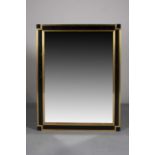 A BLACK AND GILT WALL MIRROR, 1970s, in Willy Rizzo style, 92 x 70cm