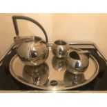 A STAINLESS STEEL FOUR PIECE TEA SET, DANISH, BY OLIVER HEMMING, with an Alessi tray