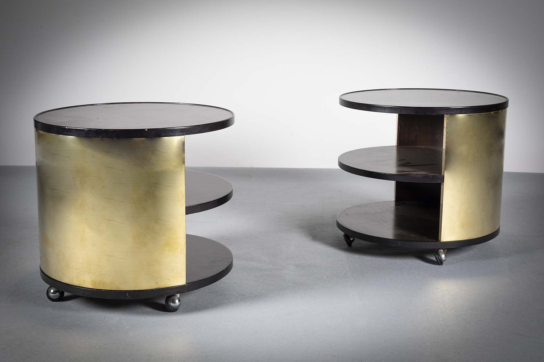 A PAIR OF ROSEWOOD AND GILT THREE TIER CIRCULAR LOW TABLES, ITALIAN 1960s, on castors, 47cm diam x