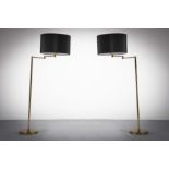 A PAIR OF BRASS ADJUSTABLE READING LAMPS, FRENCH 1970s, on circular bases, 135cm (h)