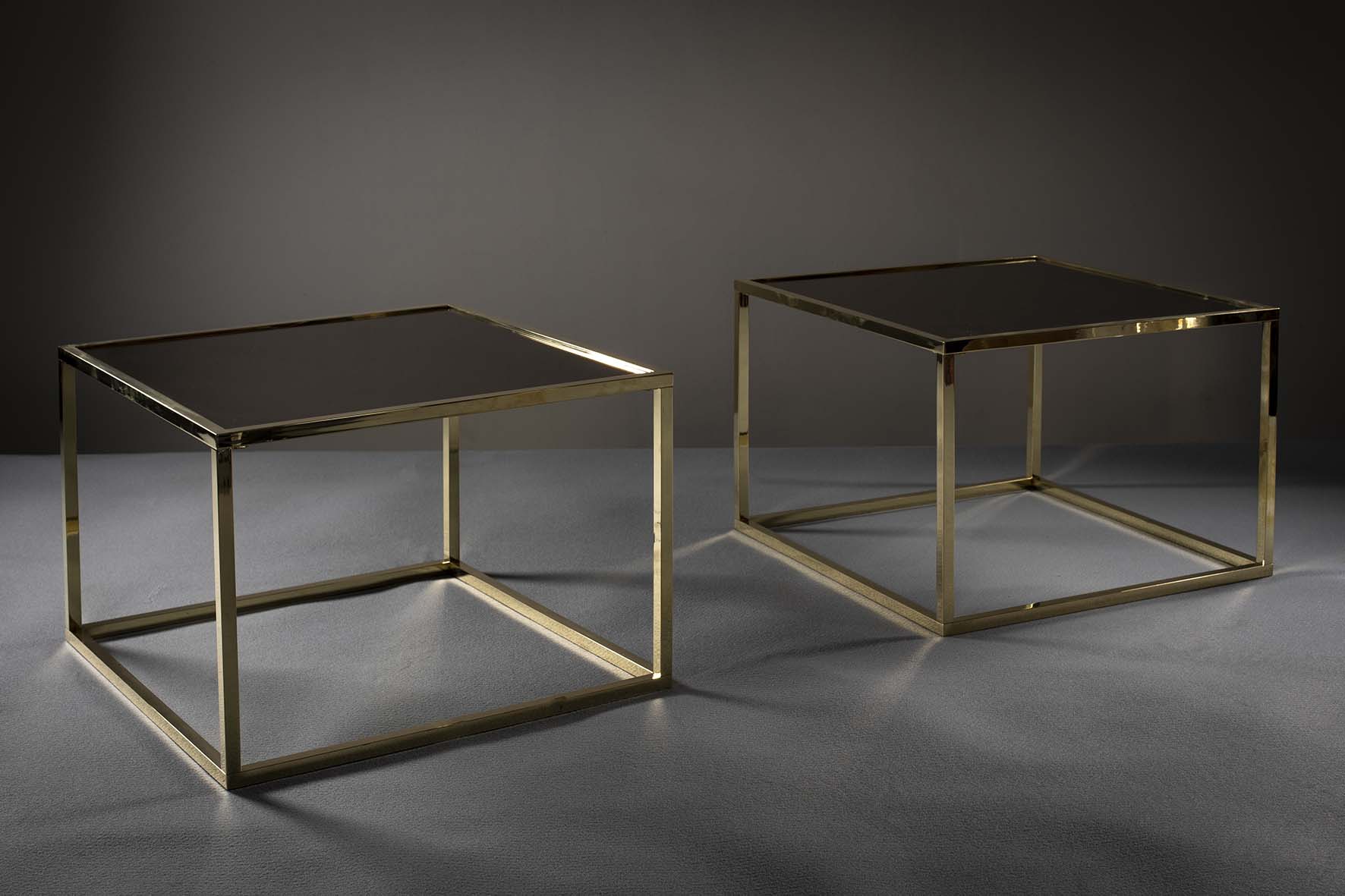 A PAIR OF GILT METAL SQUARE TABLES, FRENCH, 1970s, with inset bronzed mirrored tops, 60cm x 60 cm