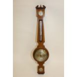 AN EDWARDIAN CROSSBANDED MAHOGANY ANEROID WHEEL BAROMETER,