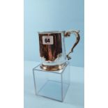 A GEORGE II SILVER TANKARD with scroll handle, engraved initials, makers mark indistinct,