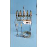 A GEORGE V SILVER FOUR-DIVISION TOAST RACK, maker:- EV.