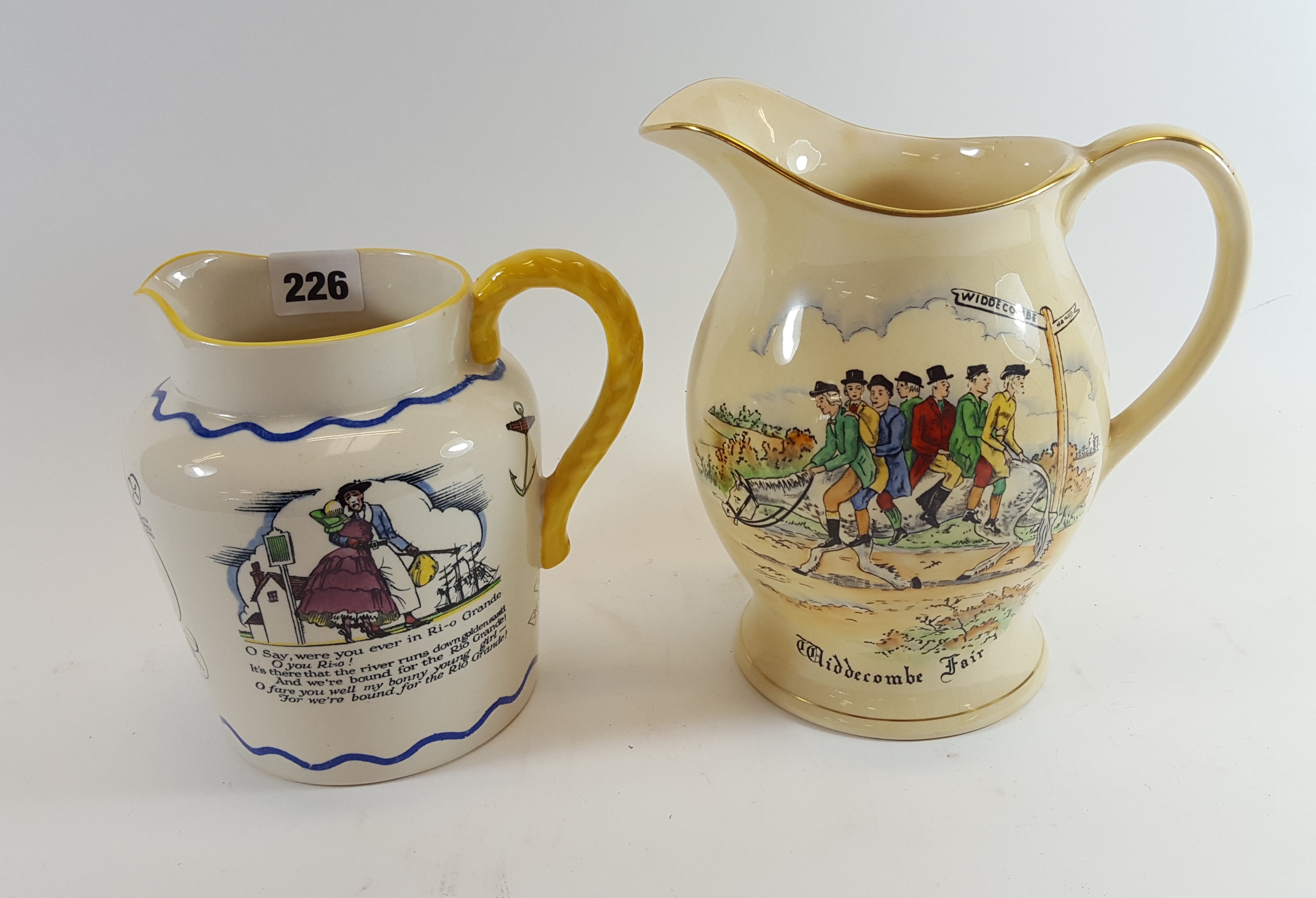 A 20TH CENTURY CROWN DEVON FIELDINGS POTTERY """"WIDDECOMBE FAIR"""" JUG with musical movement (move