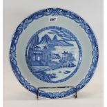 AN 18TH CENTURY CHINESE PORCELAIN DISHED BOWL with underglaze blue riverside landscape,