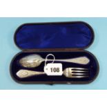 A BOXED VICTORIAN SILVER CHRISTENING SET:- Foliate engraved DESSERT SPOON AND FORK, maker:- GA,