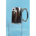 A GEORGE V SILVER TANKARD of plain tapering form, makers mark rubbed, Birmingham 1930,