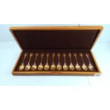 A SET OF TWELVE HALLMARKED SILVER "RSPB" BIRD TERMINAL SPOONS, boxed, approximately 316 grams.