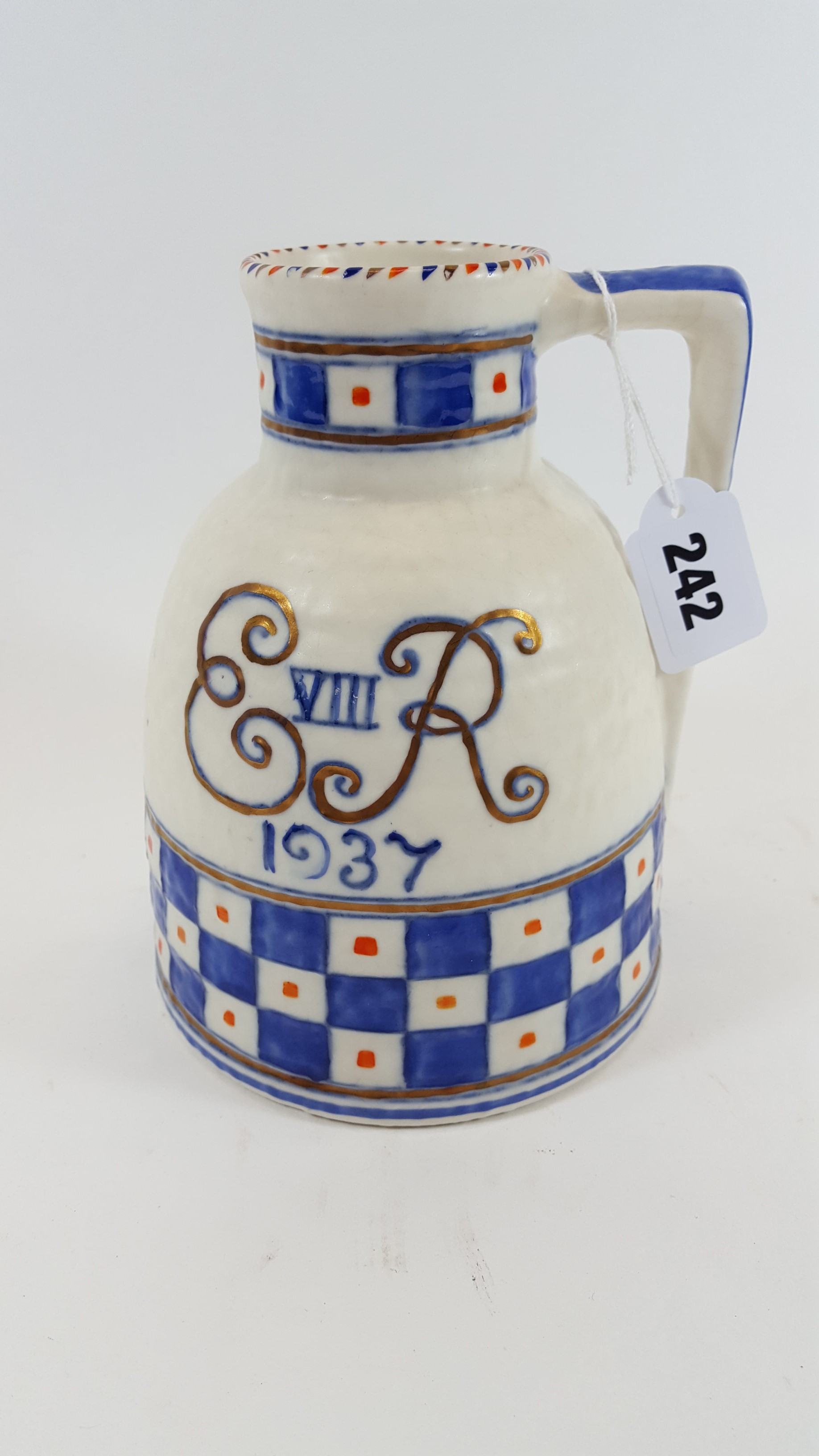 A RARE CROWN DUCAL CHARLOTTE RHEAD "EDWARD VIII 1937" COMMEMORATIVE JUG with blue chequer banding,