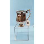 A VICTORIAN SILVER CHRISTENING MUG of waisted circular form with foliate engraved panels,