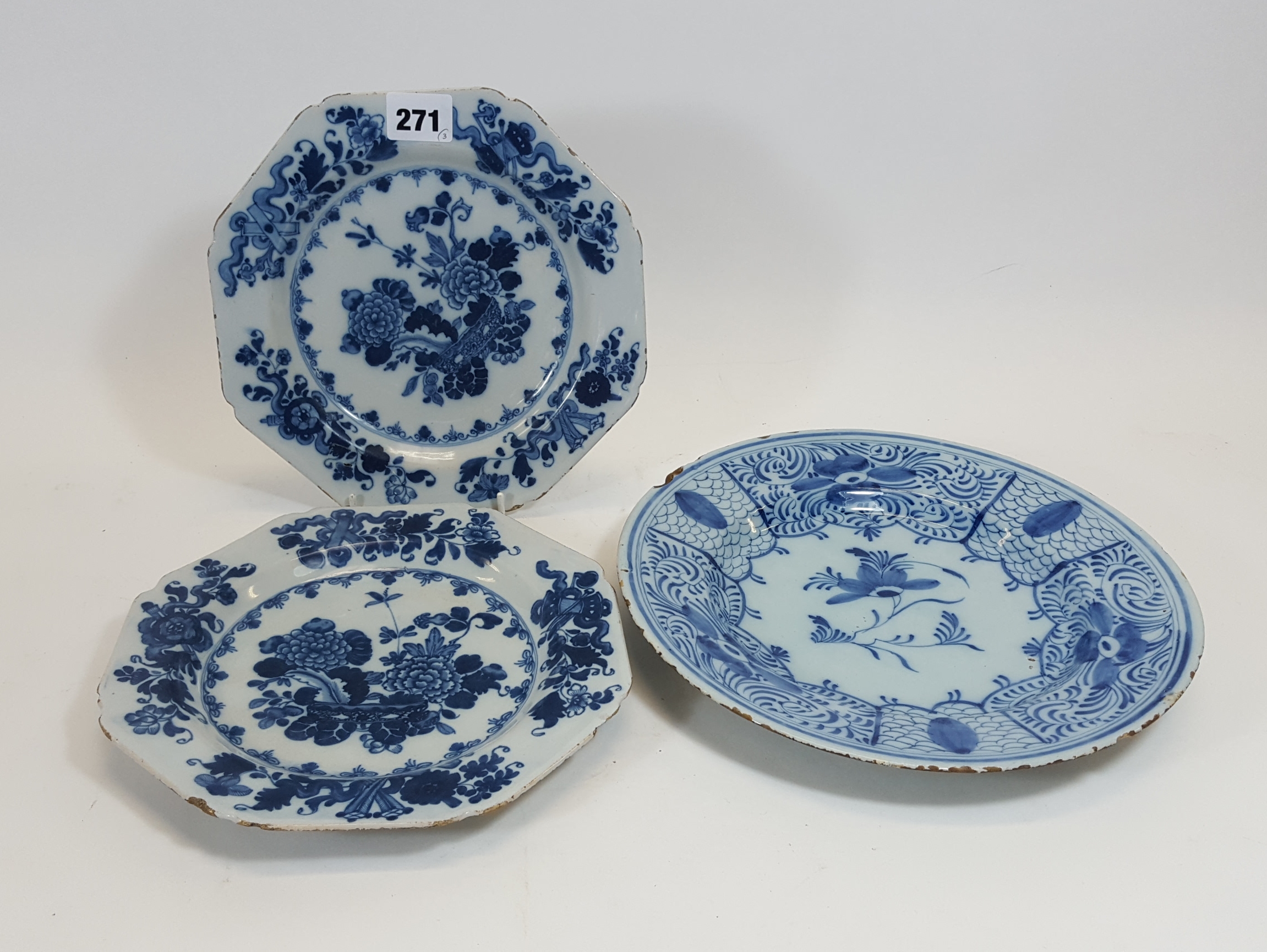 A PAIR OF 18TH CENTURY ENGLISH BLUE AND WHITE OCTAGONAL TIN-GLAZED DELFT PLATES decorated in the