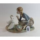 A 20TH CENTURY LLADRO PORCELAIN GROUP of a kneeling girl with two white geese, on an ovoid base,