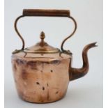 A late 19thC / early 20thC copper kettle with acorn finial to handle.