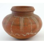 A contemporary Greek style terracotta vase of spherical form similar to a Aryballos,