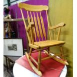 A modern pine rocking chair CONDITION: Please Note - we do not make reference to