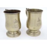 A pair of tankards with acanthus decoration to handles and engraved monogram and dog armorial.
