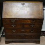 A Georgian period oak bureau CONDITION: Please Note - we do not make reference to