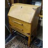 An early 20th C light oak bureau CONDITION: Please Note - we do not make reference