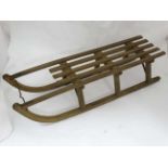 An antique wooden toboggan CONDITION: Please Note - we do not make reference to the