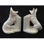 Ceramic Bookends : a pair of continental white glaze bookends formed as foxes peering over a wall ,