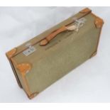 A mid 20th C canvas trimmed leather suitcase CONDITION: Please Note - we do not