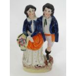 A Staffordshire flatback depicting a pair of figures CONDITION: Please Note - we do