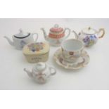 Variety of teapots and other items commemorating end of WWII and Jubilee of Queen Victoria.