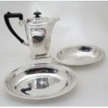 A silverplate Coffee pot and two silver plated entree dishes CONDITION: Please Note