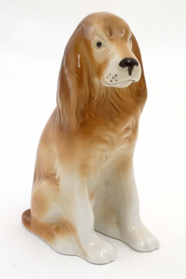 A Royal Dux Bohemia model of a Spaniel Dog , bears pink triangle and makers stamp to base.