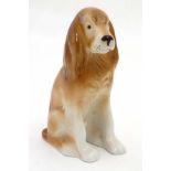 A Royal Dux Bohemia model of a Spaniel Dog , bears pink triangle and makers stamp to base.