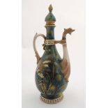 A Continental ewer decorated in an Oriental style with song bird to side amidst rushes on a