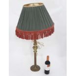 A tall brass table lamp CONDITION: Please Note - we do not make reference to the