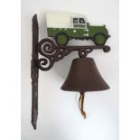 A painted cast metal wall hanging 'Land Rover' doorbell, 13'' long,