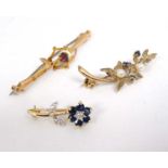 3 various 8ct gold brooches with floral decoration to include one set with sapphires and seed