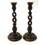 A pair of oak early 20thC turned barley twist candlesticks 12 1/4" high CONDITION: