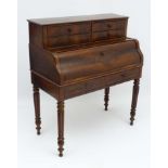 A Louis Phillipe I mahogany Bureau with four drawers above a cascading drop down flap,