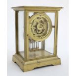 French Gilded Four- Glass Clock : a mantel clock with sprung powered escapement ,