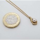 A 9ct gold pendant and chain, the pendant set with pearl and diamonds.