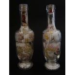 Two late 19thC / early 20thC Folk art glass bottles filled with various fabric fragments and white