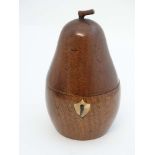 A treen tea caddy formed as a pear.