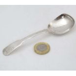 A silver fiddle pattern caddy spoon hallmarked Birmingham 1819 maker Joseph Willmore 4 3/4" long