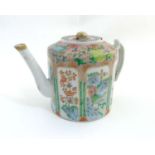 A Chinese Famille rose lidded teapot on pink ground decorated with various fruits,