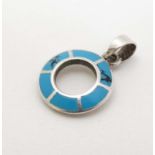 A silver pendant with turquoise enamel decoration approx.