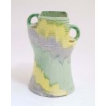 A 1930s Art Deco Beswick 'Moderne' vase , number 190, decorated in yellow, green and blue,