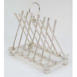 Golfing Interest : A novelty 6-slice silver plated toast rack,